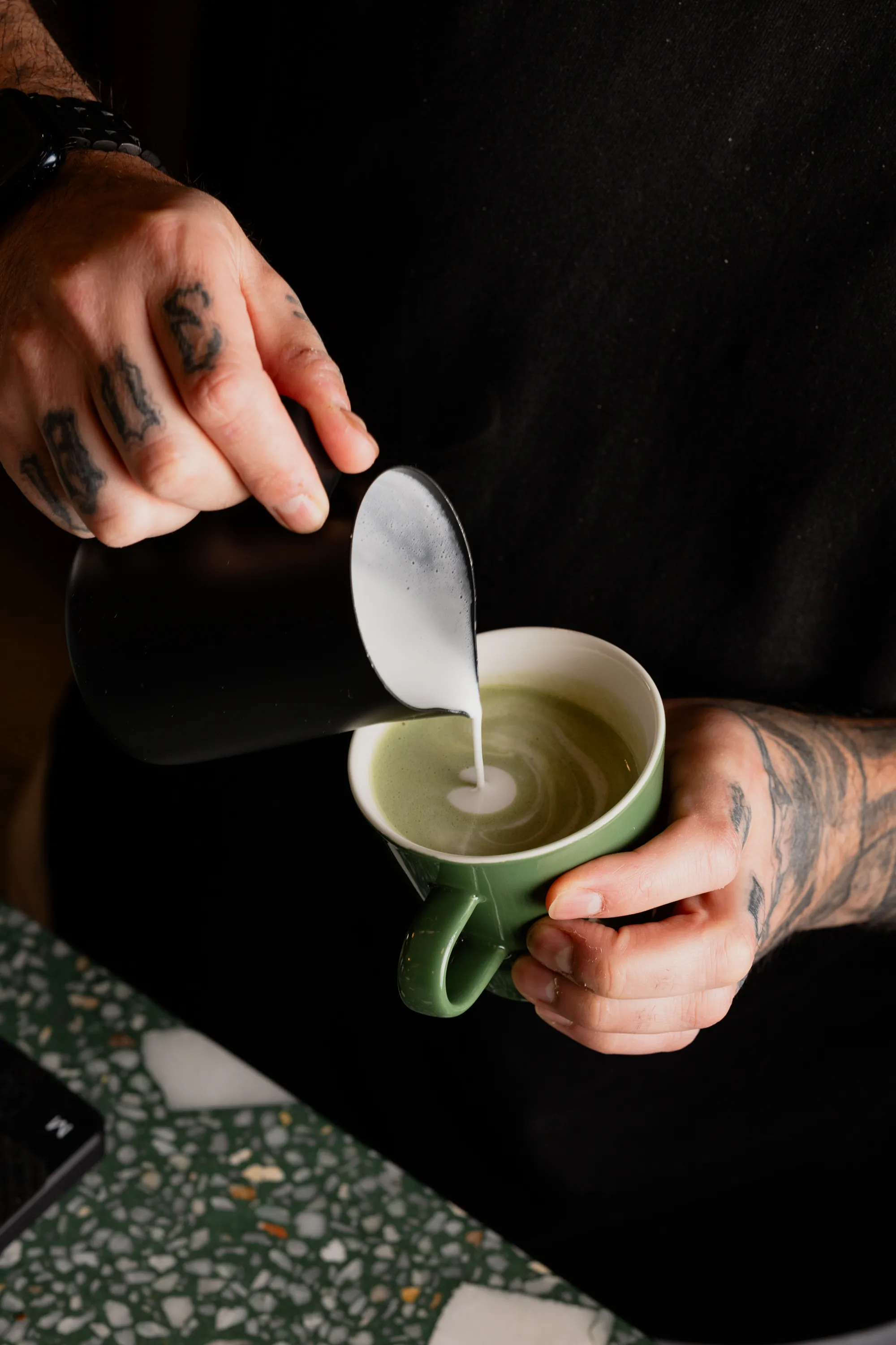Preparing a matcha latte