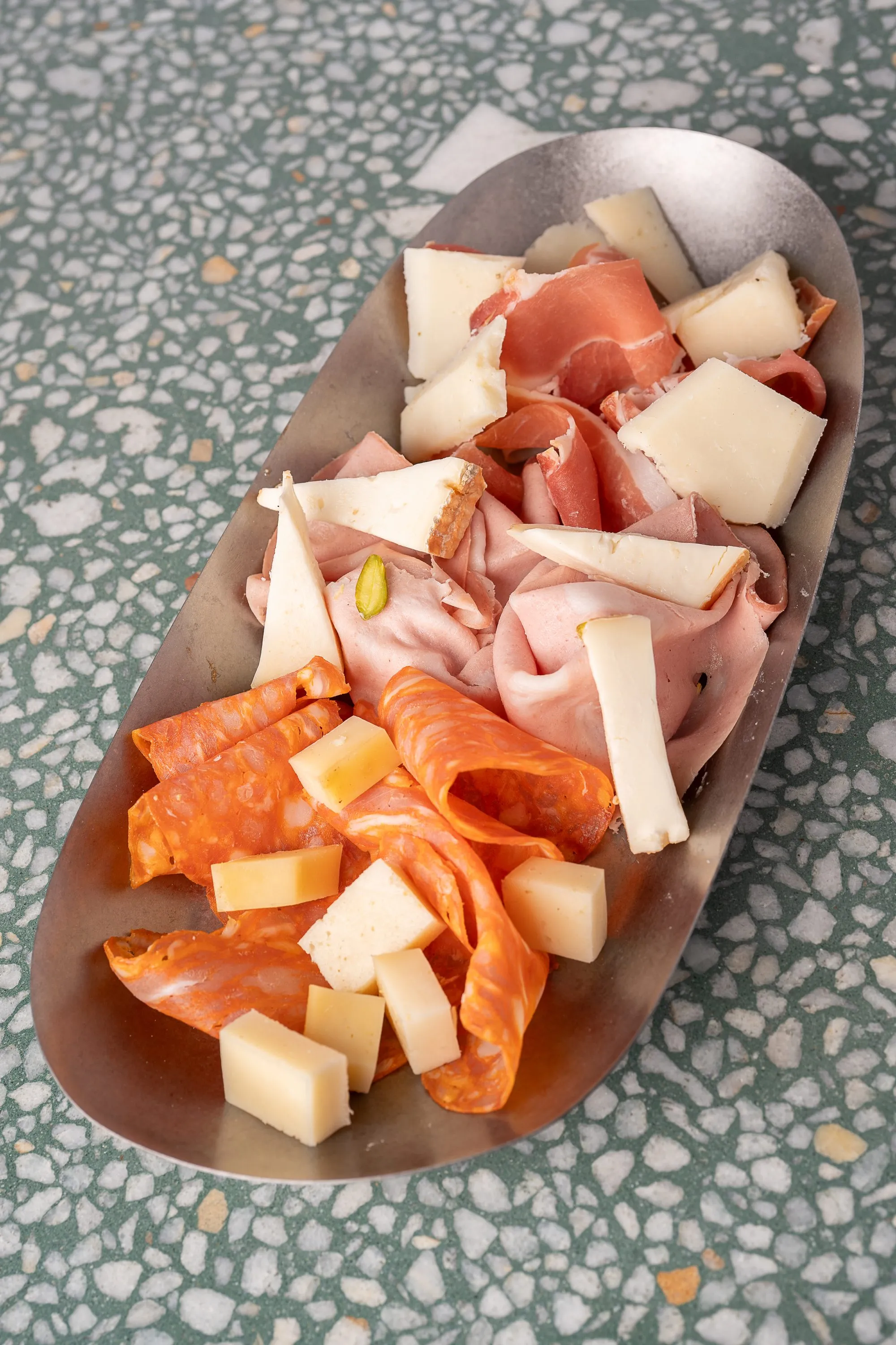 Board of Italian cured meats and cheeses with focaccia